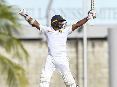 Batsman Kusal Perera celebrates after leading Sri Lanka to victory on Tuesday’s penultimate day of the historic day/night Test. (Photo courtesy CWI Media)