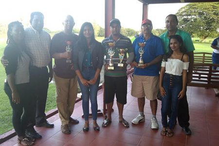 New Town Restaurant owner Rudy Ramalingum (second from left), prize winners of the tournament, club president, Aleem Hussain (second from right) along with staff of the company following Saturday’s tournament.

