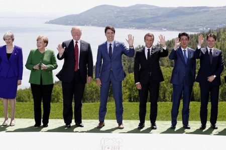 L-R: European Council President Donald Tusk, British Prime Minister Theresa May, German Chancellor Angela Merkel, U.S. President Donald Trump, Canada’s Prime Minister Justin Trudeau, French President Emmanuel Macron, Japanese Prime Minister Shinzo Abe, Italian Prime Minister Giuseppe Conte and European Commission President Jean-Claude Juncker pose for a family photo at the G7 Summit in the Charlevoix city of La Malbaie, Quebec, Canada, June 8, 2018. REUTERS/Yves Herman