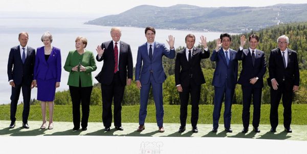 L-R: European Council President Donald Tusk, British Prime Minister Theresa May, German Chancellor Angela Merkel, U.S. President Donald Trump, Canada’s Prime Minister Justin Trudeau, French President Emmanuel Macron, Japanese Prime Minister Shinzo Abe, Italian Prime Minister Giuseppe Conte and European Commission President Jean-Claude Juncker pose for a family photo at the G7 Summit in the Charlevoix city of La Malbaie, Quebec, Canada, June 8, 2018. REUTERS/Yves Herman