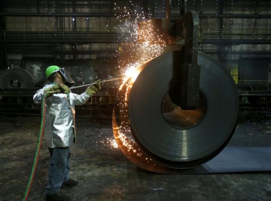 A worker cuts a piece from a steel coil at the Novolipetsk Steel PAO steel mill in Farrell, Pennsylvania, U.S., March 9, 2018.  REUTERS/Aaron Josefczyk/File Photo