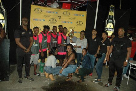 Adrian Price, captain of Trafalgar receives the championship trophy from Guinness representative Fraiche Kendall, following the conclusion of the Guinness ‘Greatest of the Streets’ Berbice Zone. Also in the photo are Guinness Brand Manager Lee Baptiste (left), Berbice Branch Manager Joshua Torrezao (3rd from right) and Events Outdoor Manager Mortimer Stewart (right)