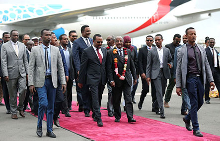 Ethiopia’s Prime Minister Abiy Ahmed welcomes Eritrean Foreign Minister Osman Saleh and his delegation at the Bole International Airport in Addis Ababa, Ethiopia June 26, 2018. REUTERS/Tiksa Negeri