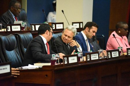 `Well-backed and secure’: Information Minister Stuart Young, left, speaks to Finance Minister Colm Imbert 