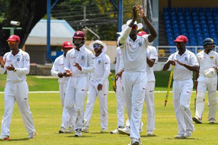 West Indies skipper Jason Holder applauds his teammates after the West Indies defeated Sri Lanka by 226 runs yesterday to take a 1-0 series lead in the three test series. (Photo courtesy of Cricket West Indies media)