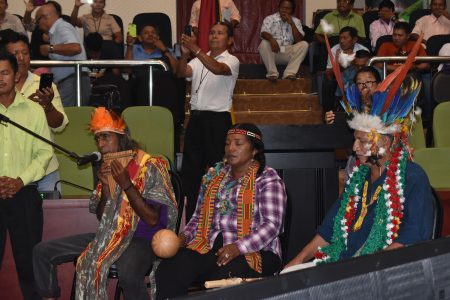  Led by Ovid Williams (right) the National Toshaos Council  yesterday for the first time participated in a traditional Indigenous ceremony to facilitate the handing over of  duties to the newly elected Executive of the body. The Council is holding its conference at the Arthur Chung Convention Centre at Liliendaal. (Mariah Lall photo) 