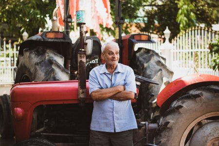 Ganga Persaud in front of his tractor (DPI photo)