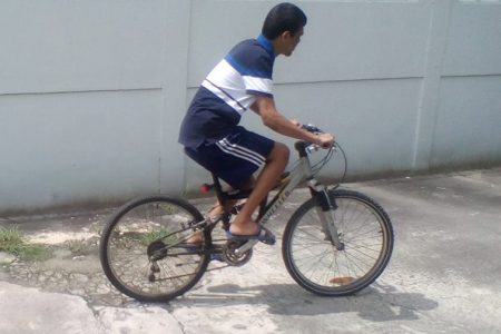  Gopaul Etwaroo rides a bicycle as part of his physical therapy.
