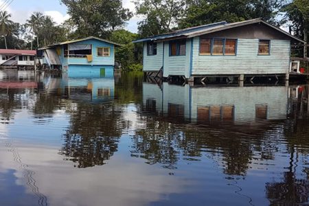 A section of Lamp Island showing the high level of the floodwater. Most of the houses are on stilts, but some are not high enough to escape the water.  