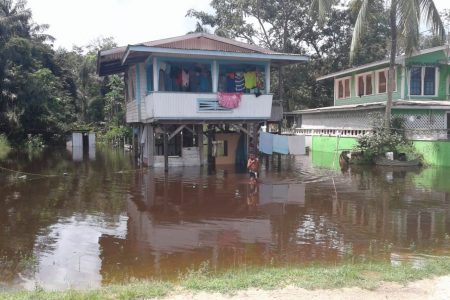  A flooded Kwakwani yard.