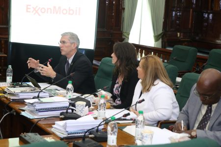 ExxonMobil’s Country Director Rod Henson (at left) addressing the committee yesterday. (Terrence Thompson photo)
