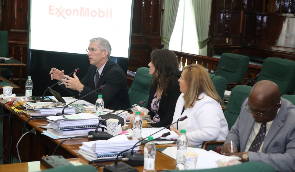 ExxonMobil’s Country Director Rod Henson (at left) addressing the committee yesterday. (Terrence Thompson photo)
