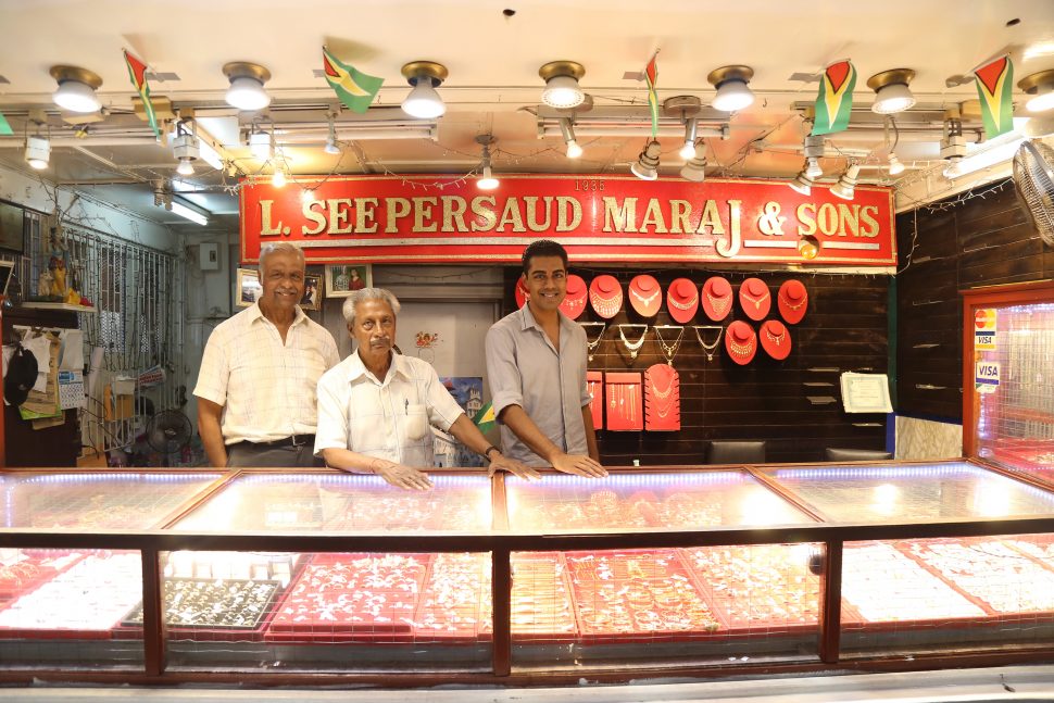 This is how the store appears in the Stabroek Market: From left are two of the Maraj brothers Ram and Heera and another relative. (SN file photo)
