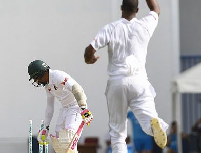 Mushfiqur Rahim looks back in disappointment to see his stumps rattled as fast bowler Shannon Gabriel celebrates, on Thursday’s second day of the opening Test. (Photo courtesy CWI Media)
