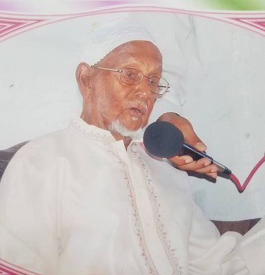 Ramjohn Mohamed Khan speaking to a gathering at his 100th birthday celebration.