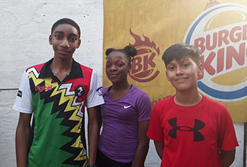 Finalists! From left, Guyana’s Shomari Wiltshire, Abosaide Cadogan and Michael Alphonso will play for the singles titles at the Junior CASA tournament in Jamaica
today.