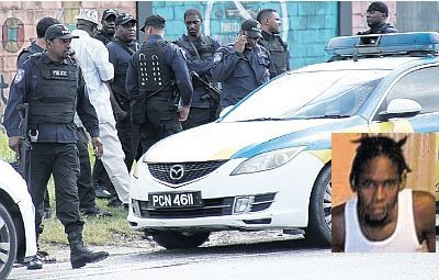 Senior police officers in the Port-of-Spain Division have launched an investigation into a shooting incident involving police officers at Hell Yard, Beetham Gardens yesterday which left a teenager (inset) dead.