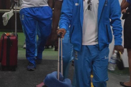  West Indies Devindra Bishoo (front) and Keemo Paul (second) arrive at the Cheddi Jagan International Airport.