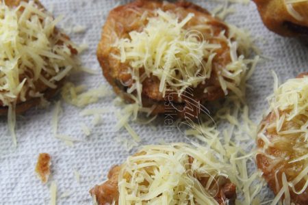Sprinkle cheese over hot Biganee (Photo by Cynthia Nelson)