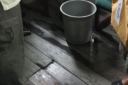 A bucket under one of the leaks in the council chamber at City Hall yesterday
