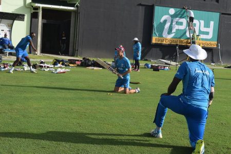 (batting windies) caption: West Indies captain Jason Holder (backing) going through the paces with assistant batting coach Toby Radford and Ashley Nurse practicing his catches
