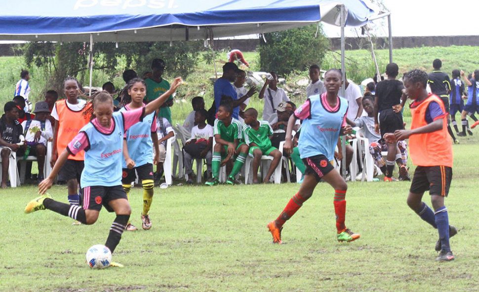 Action between South Ruimveldt and Dolphin Secondary in the Girls Section of the ExxonMobil U14 Championship at the Ministry of Education ground, Carifesta Avenue yesterday.