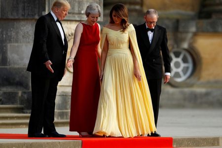British Prime Minister Theresa May and her husband Philip stand together with U.S. President Donald Trump and First Lady Melania Trump at the entrance to Blenheim Palace, where they are attending a dinner with specially invited guests and business leaders, near Oxford, Britain, July 12, 2018. REUTERS/Peter Nicholls