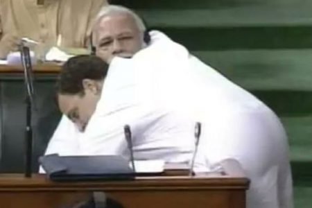 Gandhi interrupted a no-confidence debate by walking across the parliament floor to give his rival a hug. SCREENSHOT: TWITTER