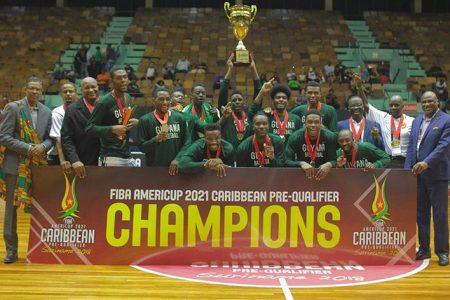 CHAMPIONS! The Guyana men’s basketball team following their historic triumph over Antigua  and Barbuda in the men’s team final of  the CARICOM Basketball championships which ended Saturday night  at the Anthony Nesty Stadium in Suriname.

