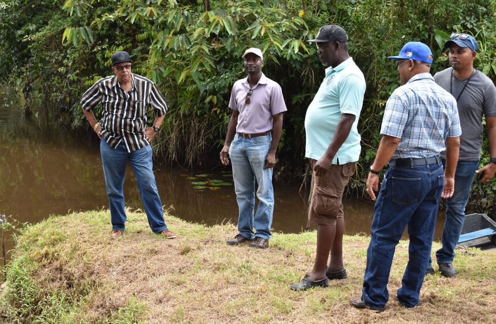 GWI officials near where the mercury was discovered (GWI photo)
