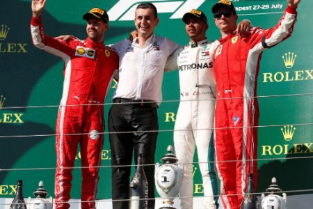 Mercedes’ Lewis Hamilton celebrates on the podium after winning yesterday’s race alongside second placed Ferrari’s Sebastian Vettel and third placed Ferrari’s Kimi Raikkonen REUTERS/Bernadett Szabo.