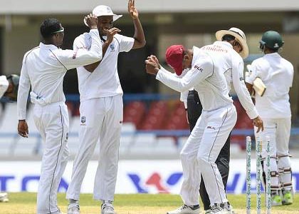 From left, Substitute Keemo Paul, Miguel Cummins and Kieran Powell celebrate West Indies’ victory in the opening Test against Bangladesh. (Photo courtesy CWI Media)