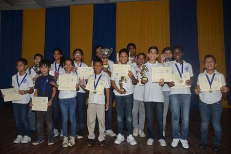 Winning bunch! The successful participants display their prizes at the end of the Marian Academy Chess Championships last Saturday.