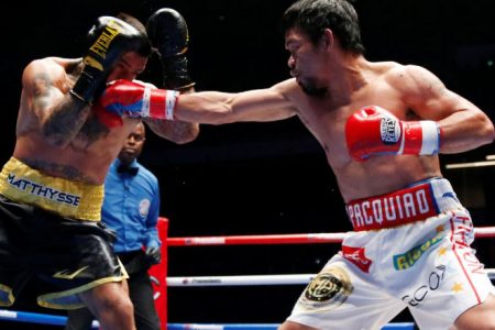 Manny Pacquiao lands a straight right on the way to securing a seventh round knockout of defending champion Lucas Matthysse to wrest his WBA welterweight title. (Reuters photo)
