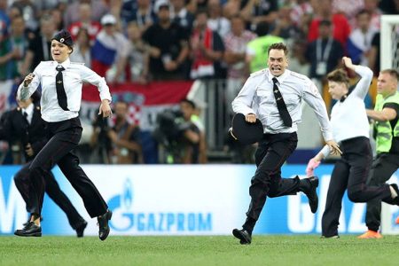 Stewards chase pitch invaders during the World Cup final between France and Croatia at Luzhniki Stadium in Moscow, Russia. Carl Recine, Reuters