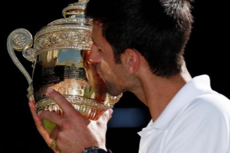 Novak Djokovic celebrates his Wimbledon triumph. (Reuters photo)
