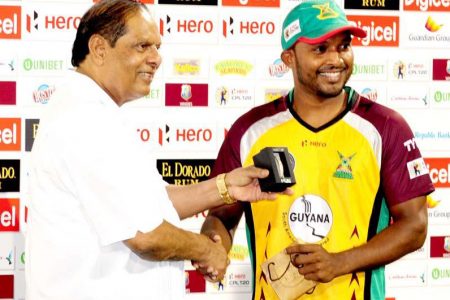 Flashback! Veerasammy Permaul collects a man of the match award from Prime Minister Moses Nagamootoo after a match at Providence last year
