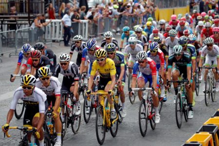 Tour de France winner Geraint Thomas (with the yellow jersey) during yesterday’s 16km 21st stage from Houilles to Paris-Champs Elysees. (Reuters photo)