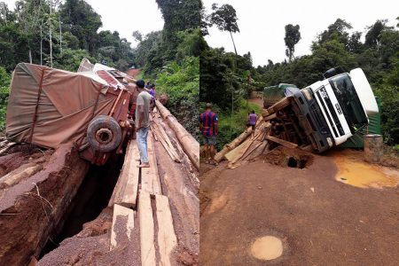This toppled truck on a bridge along the Linden to Lethem trail has prevented other vehicles from freely travelling in and out of the Rupununi. (Photo courtesy of Suzie Narine)
