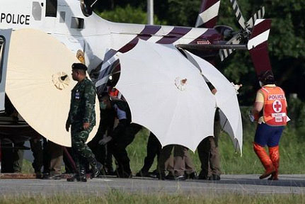 Rescued schoolboys are moved from a Royal Thai Police helicopter to an awaiting ambulance (Reuters photo)
