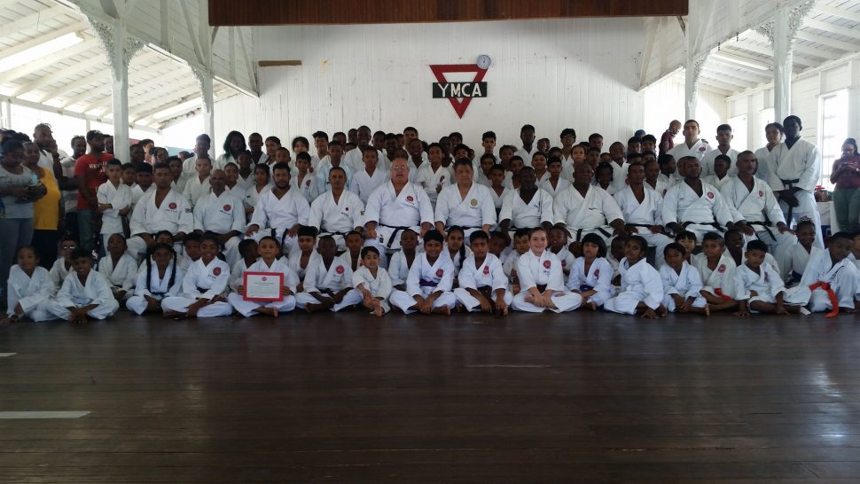 The examinees, along with their instructors and Frank Woon-A-Tai (seated centre) at last Sunday’s ASK-G grading exercise