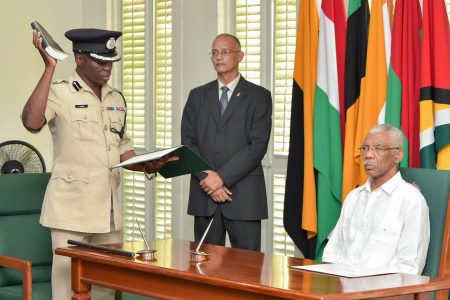 New Police Commissioner Leslie James taking the oath of office before President David Granger
yesterday.  (Ministry of the Presidency photo) 