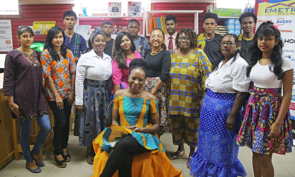Staff of the Metro stationery store all decked out in their Emancipation Day garb yesterday. (Terrence Thompson photo)