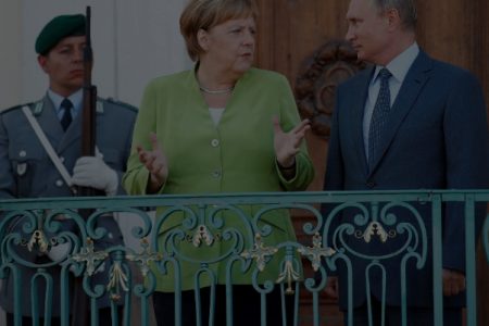 German Chancellor Angela Merkel and Russian Presi-dent Vladimir Putin during their meeting at the German government guest house Meseberg Palace in Gransee, Germany. (Sputnik/Alexei Druzhinin via REUTERS) 