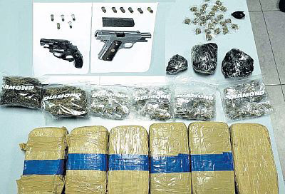 The guns, ammunition and marijuana seized by T & T Police officers