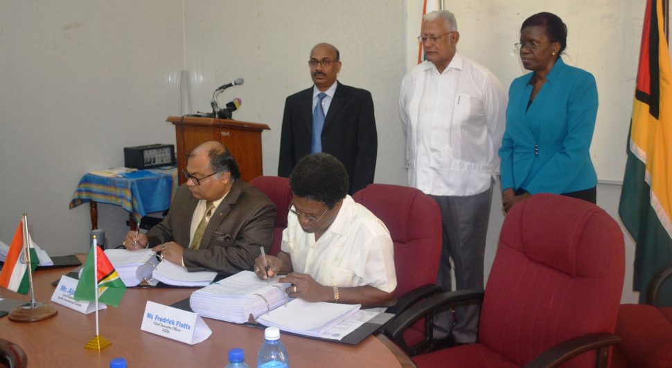 NDIA CEO Frederick Flatts (right) and Apollo Inc Representative Ajay Jha signing the pact. (Ministry of Agriculture photo)
