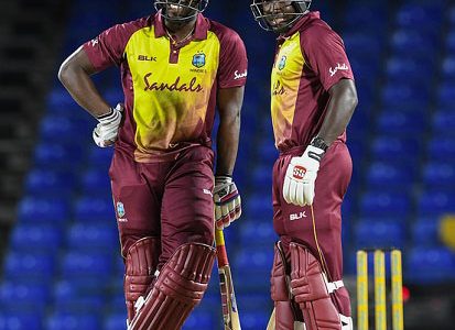 Andre Russell (left) and Rovman Powell enjoy a chat during their match-winning stand in the opening Twenty20 International against Bangladesh at Warner Park. (Photo courtesy CWI Media)
