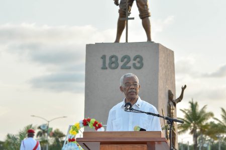 President David Granger addressing with the monument in the backdrop (Ministry of the Presidency photo)
