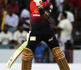 Dwayne Bravo of Trinbago Knight Riders dances in celebration after hitting the winning runs during the Hero Caribbean Premier League match between Barbados Tridents and Trinbago Knight Riders at Kensington Oval on Sunday. (Photo by Ashley Allen - CPL T20/Getty Images)

