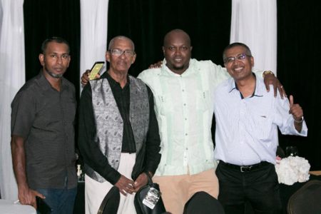 President of the GCF James Bond (second from right ) with colleagues at the GCF dinner. From left are Irshad Mohammed, Errol Tiwari and Loris Nathoo 

